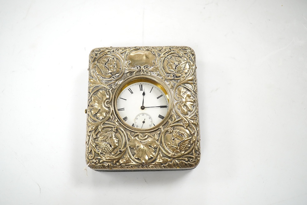 An Edwardian silver mounted leather travelling watch case, Birmingham, 1904, 95mm, with a gun metal cased pocket watch. Condition - poor